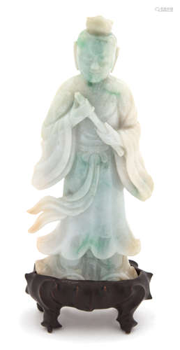 A Carved Apple Green and Jadeite Figure of an Immortal