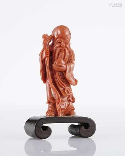 Statuette figurant une divinité, ChineCorail rouge sculpté, H 9 cm