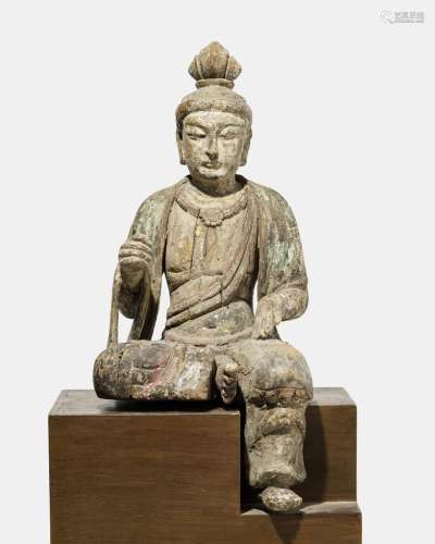 Guanyin (bodhisattva de la compassion), Chine, dynastie Ming (1368-1644) ou antérieurFiguré assis sur la jambe gauche, l'autre repliée, bois sculpté, traces de polychromie, H 55 cm