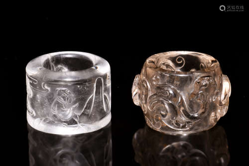 TWO CRYSTAL CARVED THUMB RINGS