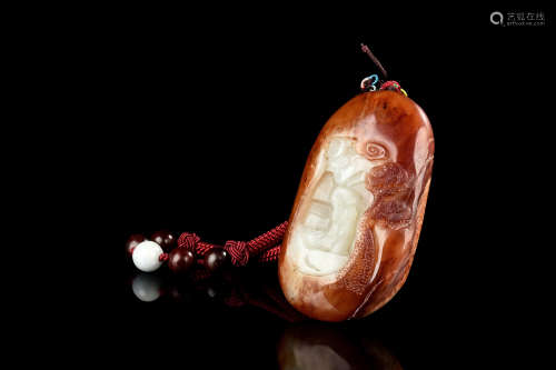 CLEVERLY CARVED JADE PENDANT