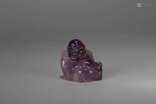 A Chinese Carved Amethyst Buddha
