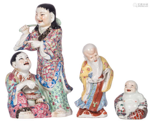 A Chinese polychrome decorated group, a Shou Xing figure and a Budai, H 11 - 34 cm