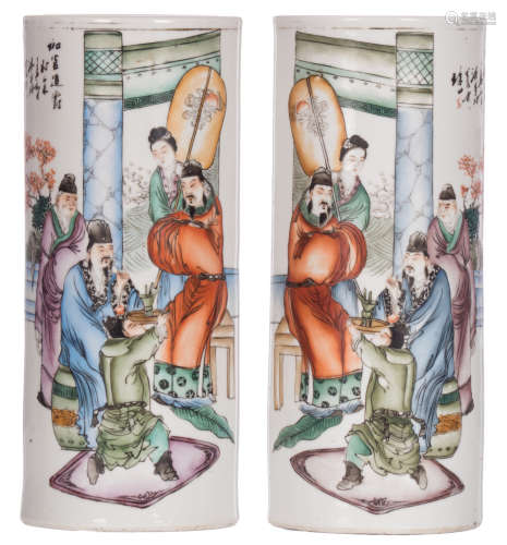 A pair of Chinese polychrome cylindrical vases, decorated with an animated scene and a calligraphic text, marked, H 28,7 cm