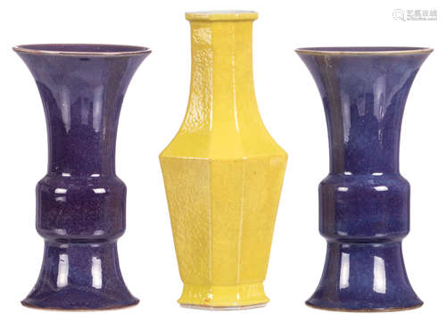 Two Chinese purple monochrome Gu vases, H 30 cm; added a Chinese lemon monochrome octagonal baluster shaped vase, H 35 cm