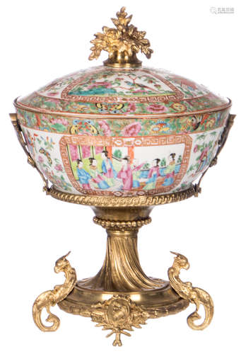 A Chinese Canton famille rose floral decorated bowl and cover, the roundels decorated with court scenes and birds on flower branches, with gilt brass mounts, 19thC, H 38 - ø 25 cm