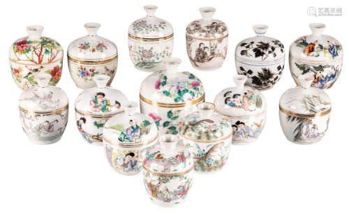 Fourteen Chinese famille rose and polychrome jars and covers, decorated with figures, flower branches and calligraphic texts, some marked, ø 8,5 - 12,5 cm
