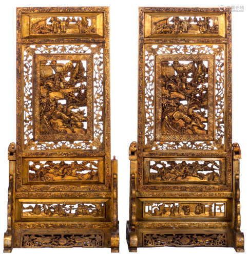 A pair of Chinese gilt wooden screens depicting court scenes and warriors, H 100 - W 47 - D 37 cm