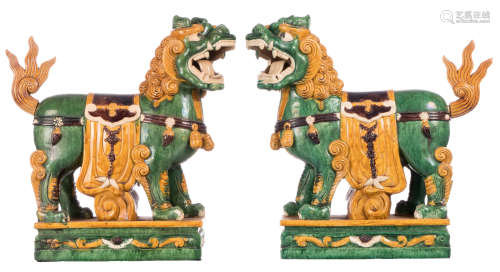 A pair of Chinese sancai glazed temple guards in earthenware, 20thC, (tails separately), H 54 cm