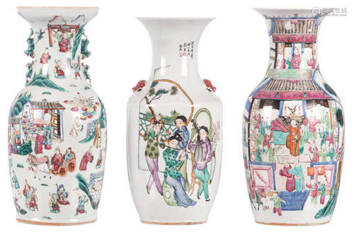 Two Chinese famille rose vases, overall decorated with an animated scene; added a ditto vase, polychrome decorated with calligraphic texts, H 43 - 45,5 cm