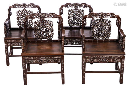 Four Chinese carved hardwood mother of pearl inlay armchairs with floral motives, a Fu lion, bats and birds, H 98,5 - W 61,5 - D 47 cm