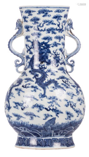 A Chinese blue and white baluster shaped vase, decorated with playing dragons, 19thC, H 38,2 cm