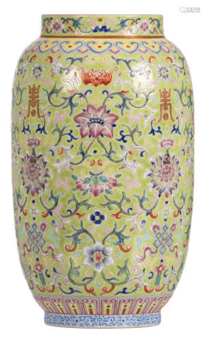 A Chinese green ground floral decorated vase with bats and auspicious symbols, with a Jiaqing mark, H 27 cm