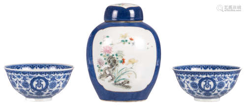 Two Chinese blue and white bowls with auspicious symbols, with a Qianlong mark, H 5 cm - ø 11 cm; added a Chinese bleu poudré jar and cover, the roundels famille rose decorated with birds, butterflies and flower branches, 19thC, H 15 cm