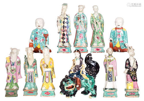 A collection of eleven polychrome decorated Chinese statues, including a complete set of Immortels, two incense burners and one Guanyin on a kylin, H 16,5 - 22 cm