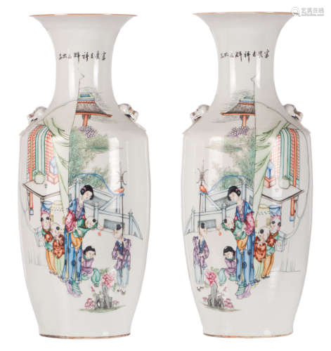 A pair of Chinese polychrome decorated vases with a lady and playing children and calligraphic texts, H 57 cm