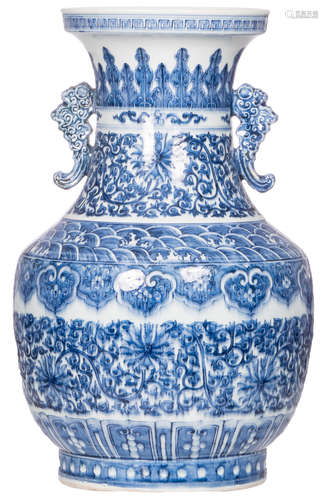 A Chinese blue and white floral and relief decorated baluster shaped vase, H 55 cm