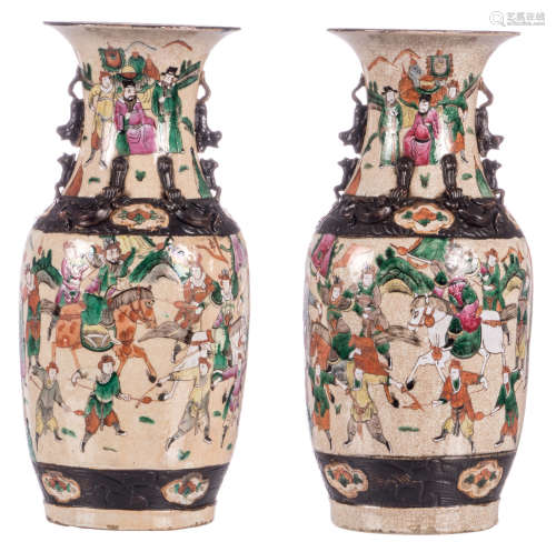 A pair of Chinese polychrome stoneware vases, overall decorated with warrior scenes, marked, about 1900, H 45,3 cm