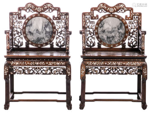 A pair of Chinese carved hardwood armchairs, mother of pearl and floral decorated with auspicious symbols, with marble seat and medaillon, H 100,5 - W 64 - D 50 cm