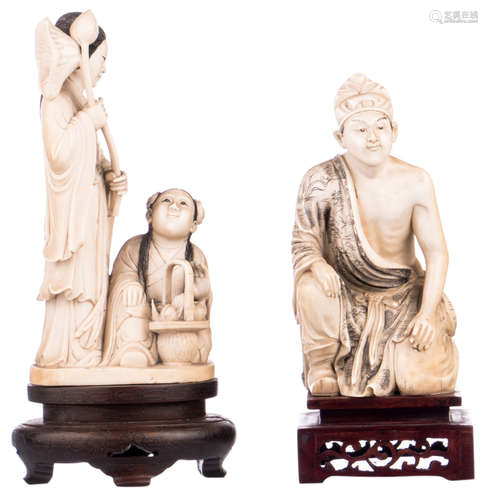 A Chinese carved ivory group depicting two girls with flowers, first half of the 20thC, on a matching wooden stand; added a ditto figure depicting a kneeling man, marked, H 16 - 18 (without stand) - 20 - 23 cm (with stand) - Weight: about 707 - 761g (with stands)