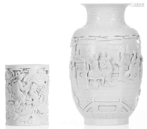 A Chinese biscuit porcelain vase, relief decorated with women in a garden, with a Guangxu mark, H 27 cm; added a ditto brush pot decorated with ladies in an overgrown environment, with a Qianlong mark, H 13,5 cm