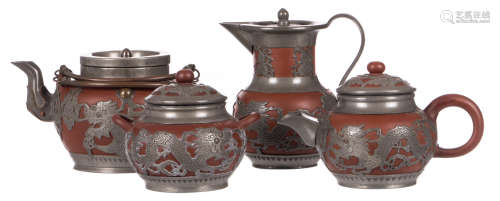 A Yixing red stoneware four piece tea set with pewter dragon shaped overlay, marked, H 10,5 - 15 cm