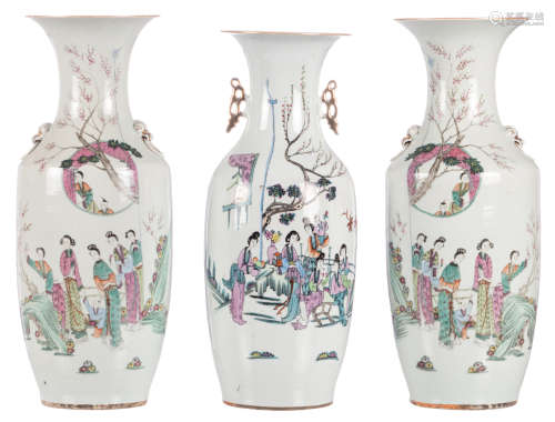 A pair of Chinese famille rose vases, decorated with a gallant scene and calligraphic texts; added a ditto vase, H 57,5 - 59,5 cm