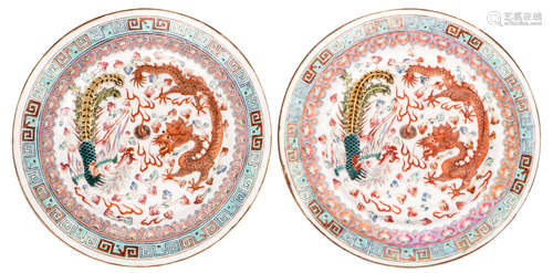 Two Chinese famille rose dishes, decorated with a dragon, a phoenix and a flaming pearl, marked Guangxu and period, ø 22,5 cm