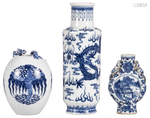 A small Chinese blue and white floral and dragon relief decorated moon flask, the roundels with a mountainous landscape; added two Chinese blue and white decorated vases, one with dragons and one with phoenixes, one with a Yongzheng mark, H 16 - 30 cm