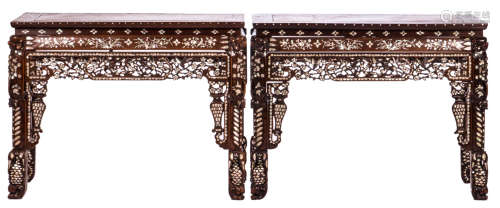 A pair of Chinese carved hardwood mother of pearl side tables, floral decorated, with marble top, H 83 - W 108 - D 54 cm