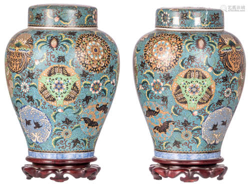 A pair of Japanese cloisonné floral and with birds and bats decorated jars and covers, marked, 19thC, on a matching wooden base, H 37 (without base) - 42,5 cm (with base)