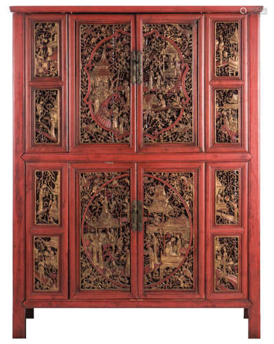 A Chinese pierced and richly carved painted and gilt wooden side cabinet, the doors and panels with animated scenes, H 178 - W 45 - D 47,5 cm