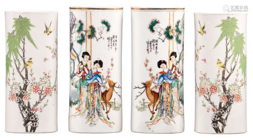 Two pairs of Chinese cylinder shaped polychrome decorated vases, one pair with birds and a flower branch and one pair with ladies, a deer and a calligraphic text, one pair marked and signed, H 27,5 - 28,5 cm