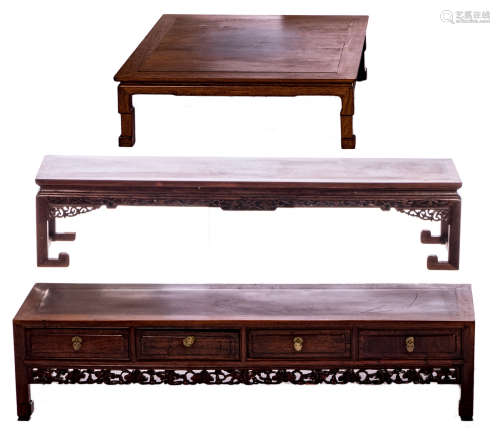 Two Chinese carved hardwood occasional tables, one table with drawers, H 34,5 - 36 - W 151 - 157 - D 34 - 36 cm; added a ditto square table, H 36 - 94 x 94 cm