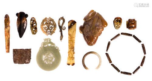 Various jade items: a green jade Bi disk, decorated with chilong, ø 13,2 cm; a green-grey jade bracelet, ø inner measure 6 - ø outer measure 7,9 cm; a green brown marbled jade scepter, W 18,3 cm; a grey-green jade disk, W 7,5 cm; a grey marbled jade chilong shaped pendant, W 10 cm; a mythical toad, W 14 cm; five extra items, 4,9 - 15 cm and ten honey coloured stone beads