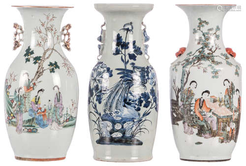 Two Chinese polychrome decorated vases with ladies in a garden and calligraphic texts; added a Chinese celadon ground blue and white decorated vase with a phoenix on a rock and flower branches, H 43 - 44,5 cm