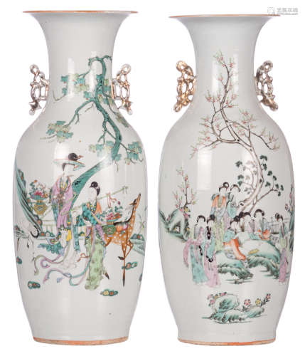 A Chinese famille rose vase, decorated with court ladies, a crane and a deer; added a ditto vase, decorated with a gallant scene and calligraphic texts, H 57 cm