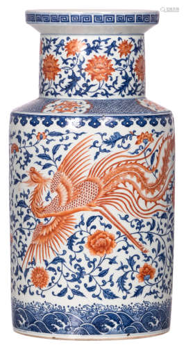 A Chinese rouleau shaped vase, iron red decorated with a dragon and a phoenix on a blue and white floral painted setting, with a Qianlong mark, H 52 cm