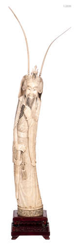 A Chinese carved ivory figure depicting a warlord, marked, first half of the 20thC, on a wooden stand, H 86 (without stand) - 97,5 cm (with stand) - Weight: about 10,2kg (without stand)