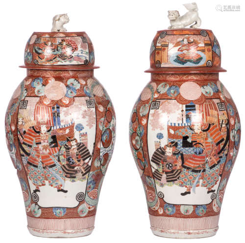 A pair of Japanese Meiji period vases and covers, polychrome decorated with cranes and floral motives, the roundels with warriors and animated scenes, H 96 cm