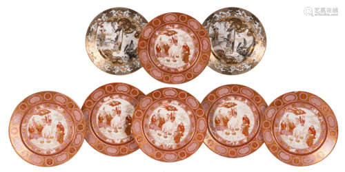 A lot of six Japanese decorative kinrande dishes, decorated with Buddhist symbols, Meiji period, ø 23,5 cm; added two Japanese polychrome decorated dishes, the roundels with gold-layered brocade painting, Meiji period, ø 23 cm