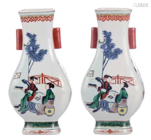 Two Chinese wucai decorated Hu vases with animated scenes and flower vases, H 26 cm