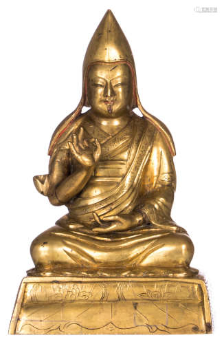A Sino-Tibetan gilt bronze seated Lama, with traces of polychromy, 18thC, H 16 - W 10,5 cm