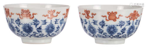 A pair of Chinese blue and white and iron red decorated bowls with flowers and auspicious symbols, marked Guangxu, H 6 - ø 10,5 cm