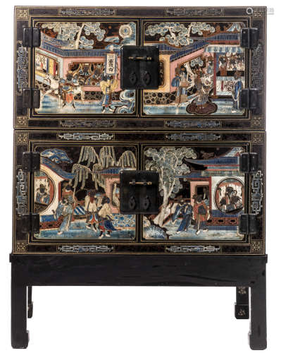 A Chinese polychrome decorated black lacquer cabinet-on-stand with animated scenes and flower branches, H 110 - W 82 - D 52 cm