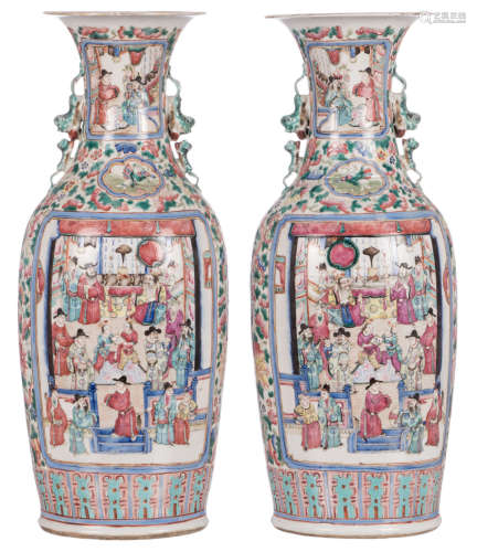 A pair of Chinese famille rose floral decorated vases, the roundels decorated with warriors and court scenes, 19thC, H 61 cm