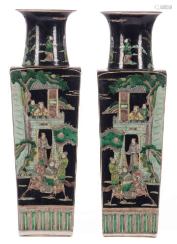 A pair of Chinese quadrangular famille noire vases, famille verte decorated with animated scenes, with a Kangxi mark, H 50 cm