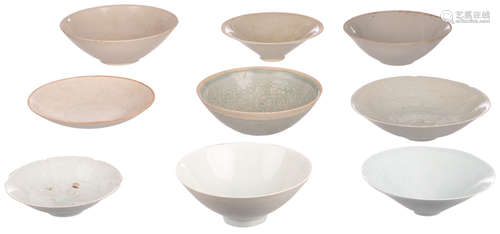 Nine qing bai bowls of the Southern Song type, five with cut and four with impressed decoration, H 4,5 - 7 - ø 14,7 - 20 cm