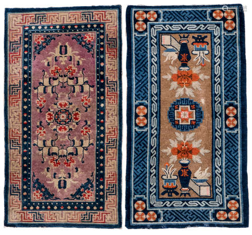 Two Chinese rugs, one floral decorated and one with antiquities, with meandering friezes, wool on cotton, 70 x 136 and 71 x 136 cm