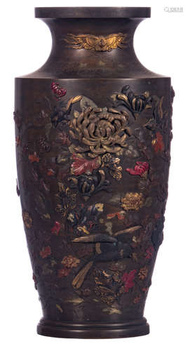 A Japanese overall polychrome and relief decorated bronze vase with birds on flower branches and a phoenix, Meiji period, H 55 cm